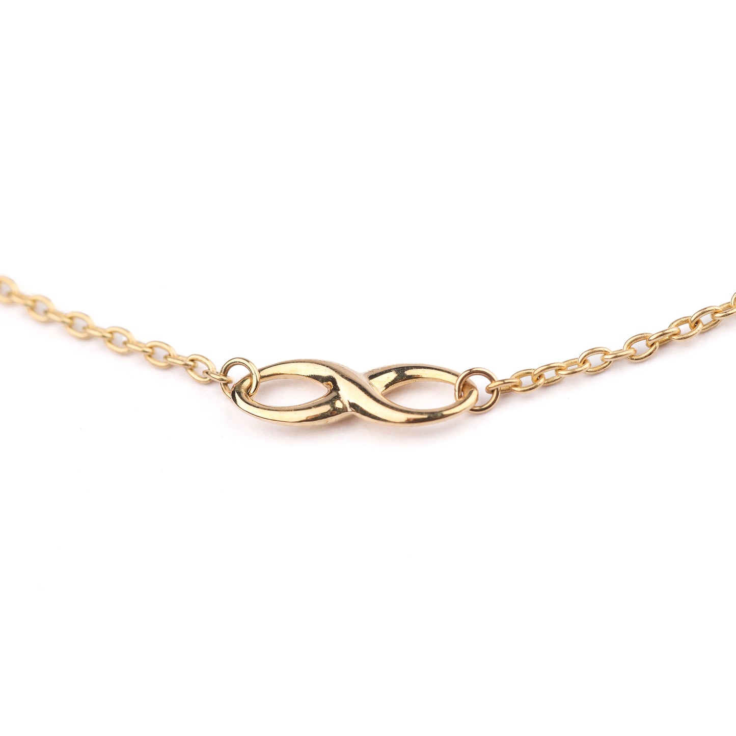 Women's 9K solid yellow gold bracelet with infinity symbol as part of the chain, on a white background