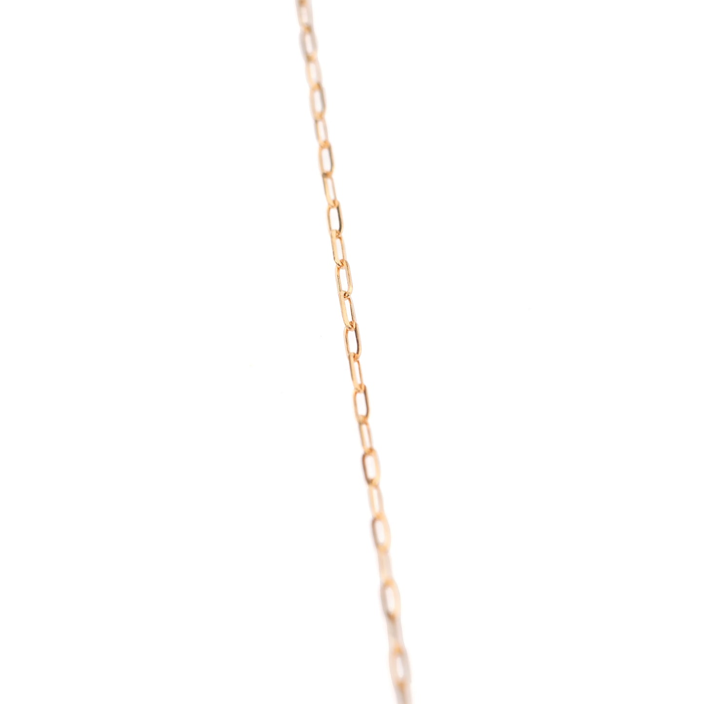 Women's 14K solid gold delicate thin paperclip style chain bracelet on a white background