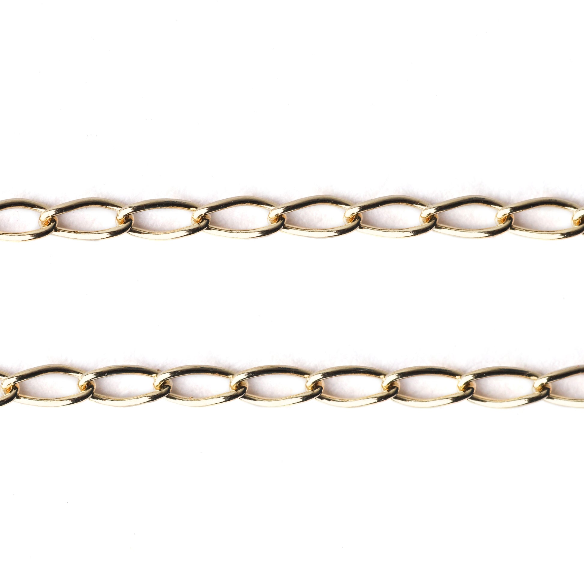 Women's solid gold curb chain bracelet and necklace on a white background