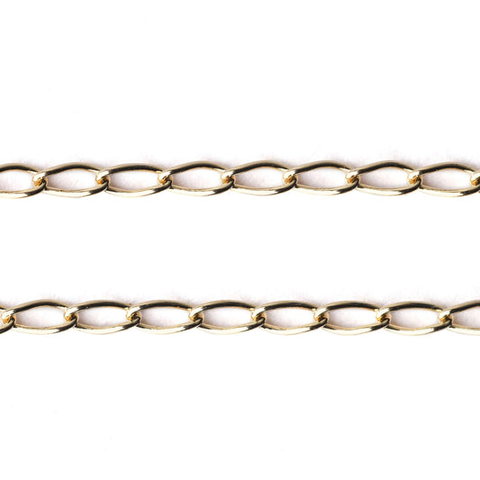 Women's solid gold curb chain bracelet and necklace on a white background