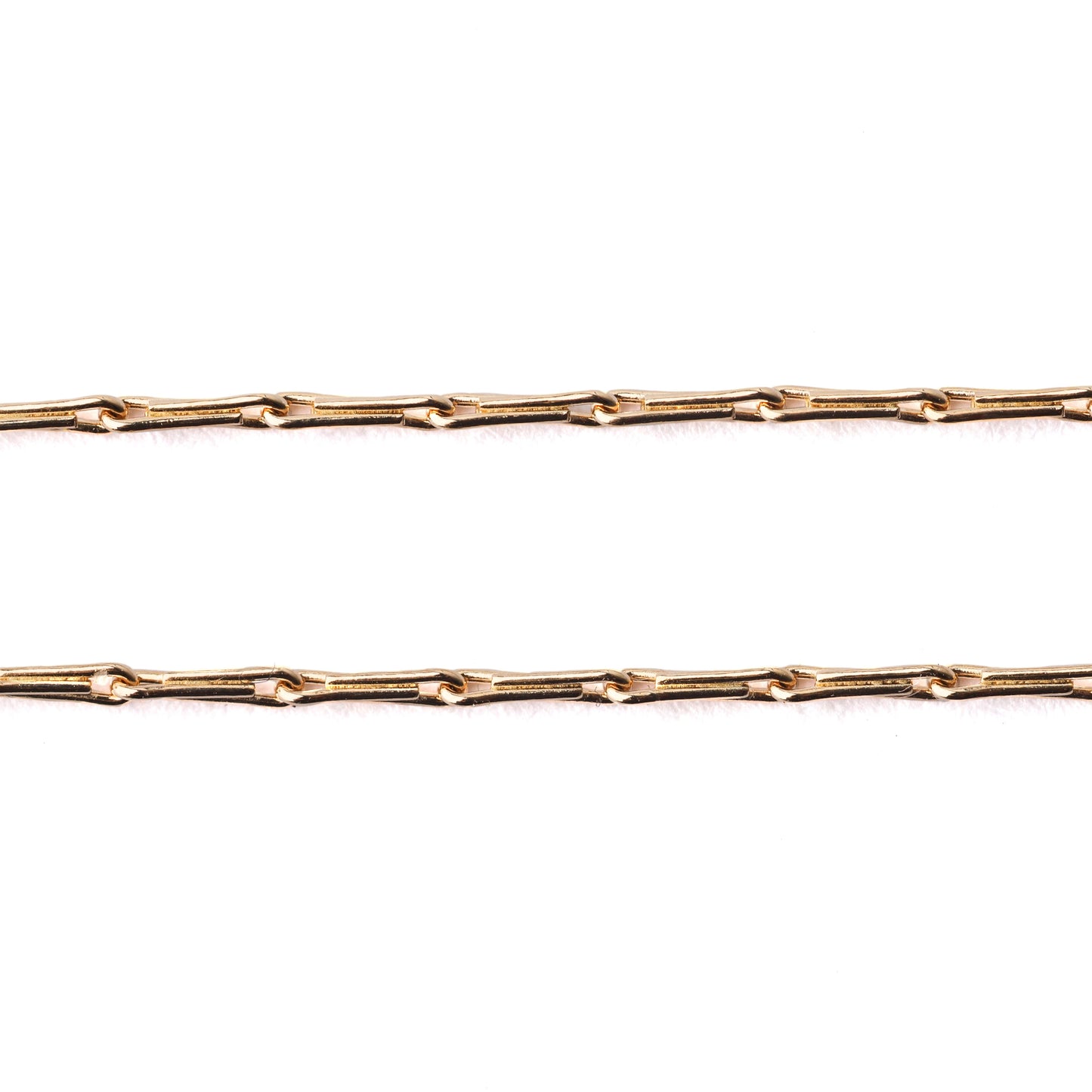Women's solid gold hayseed chain necklace and bracelet on a white background