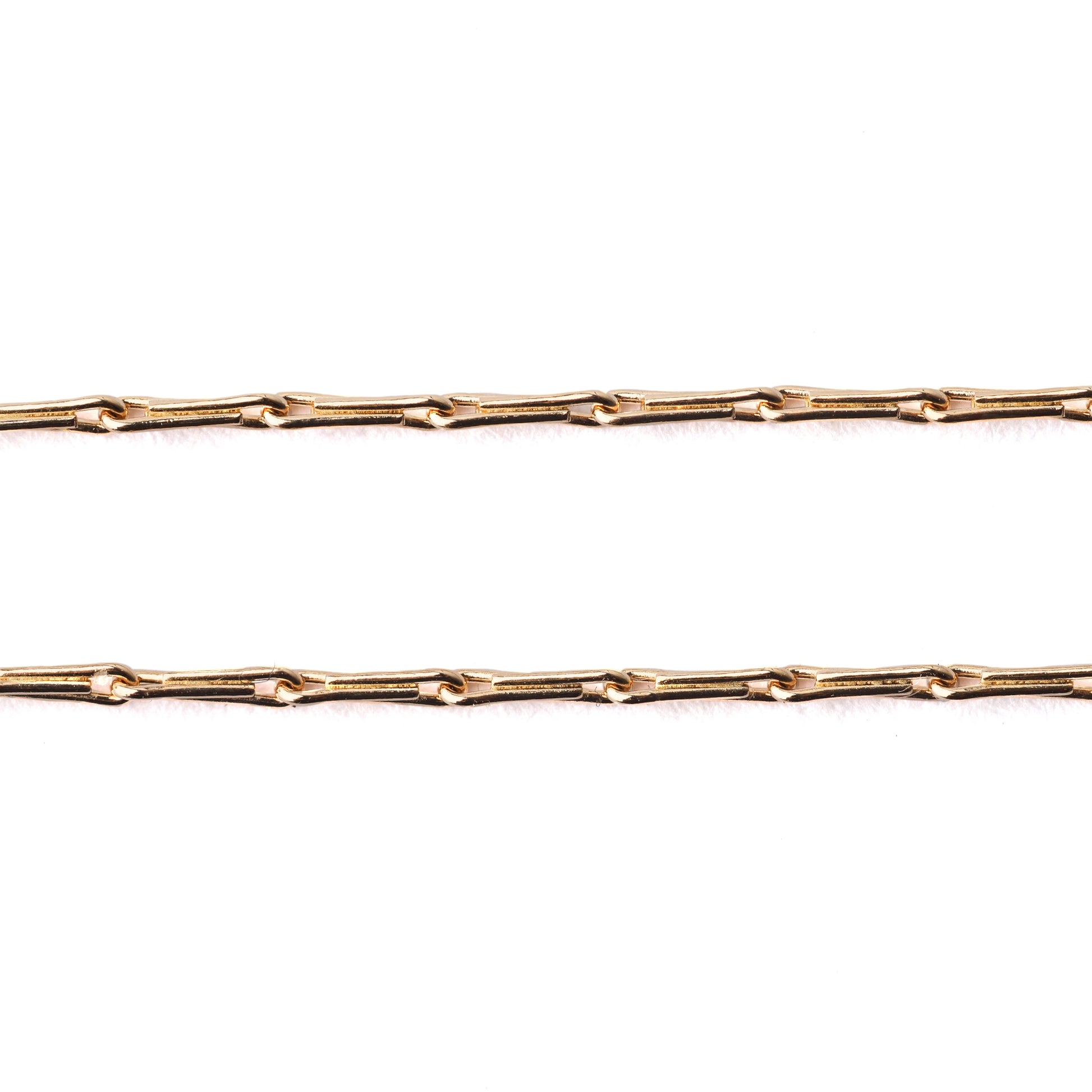 Women's solid gold hayseed chain necklace and bracelet on a white background