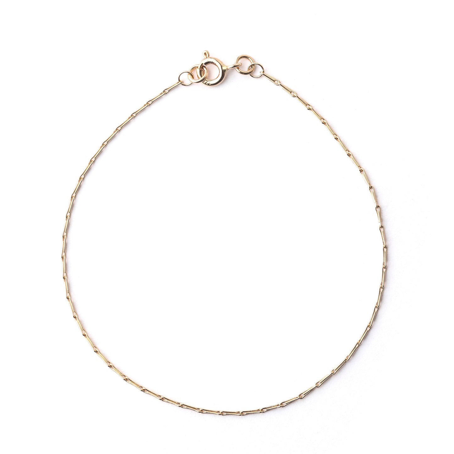 Women's solid gold hayseed chain bracelet on a white background