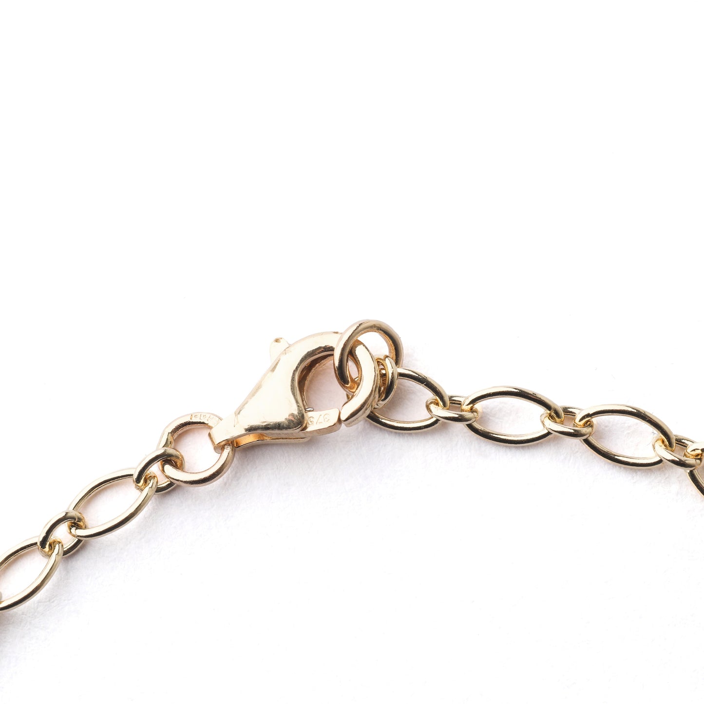 Women's solid gold chain bracelet necklace on a white background