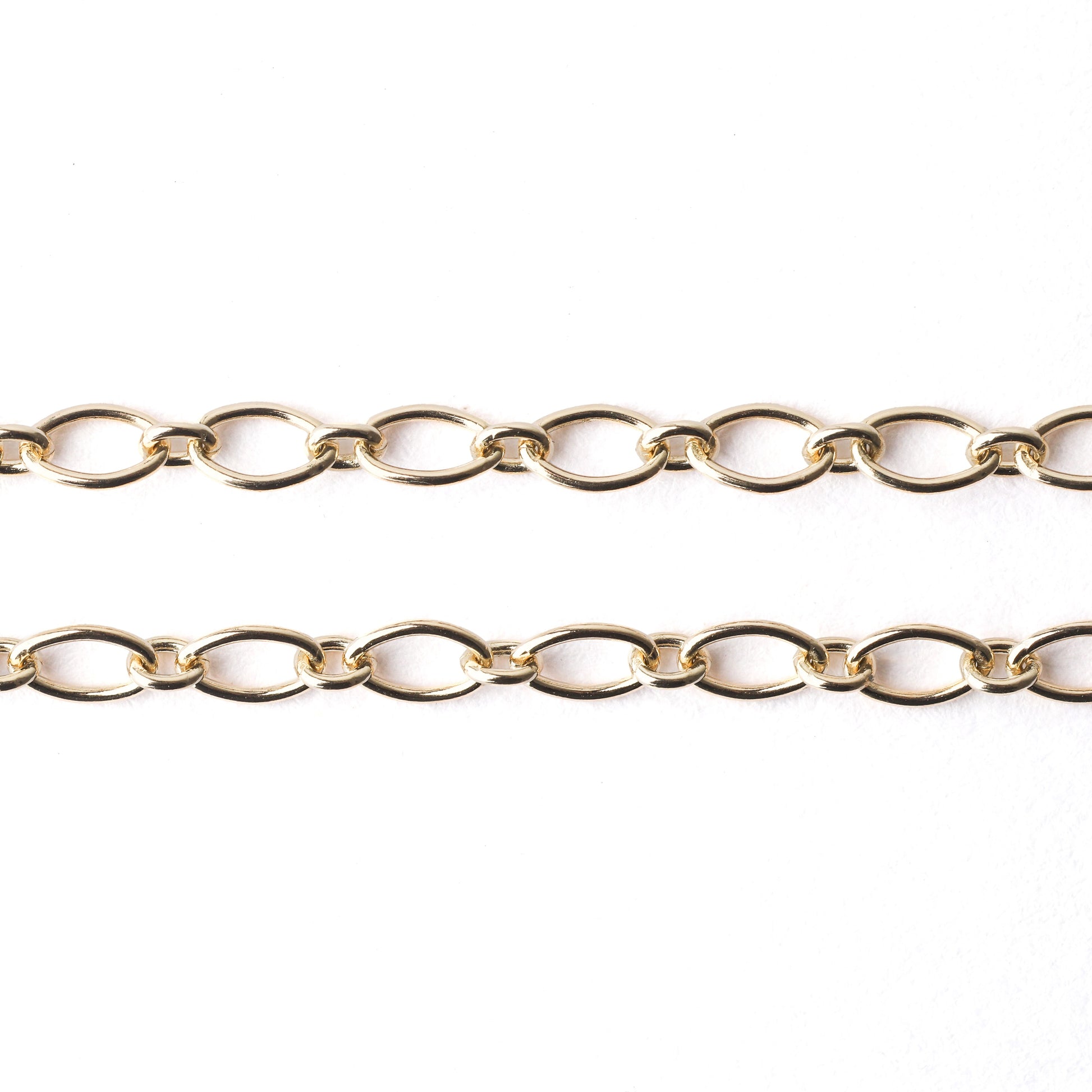 women's solid gold trace chain for bracelet and necklace on a white background