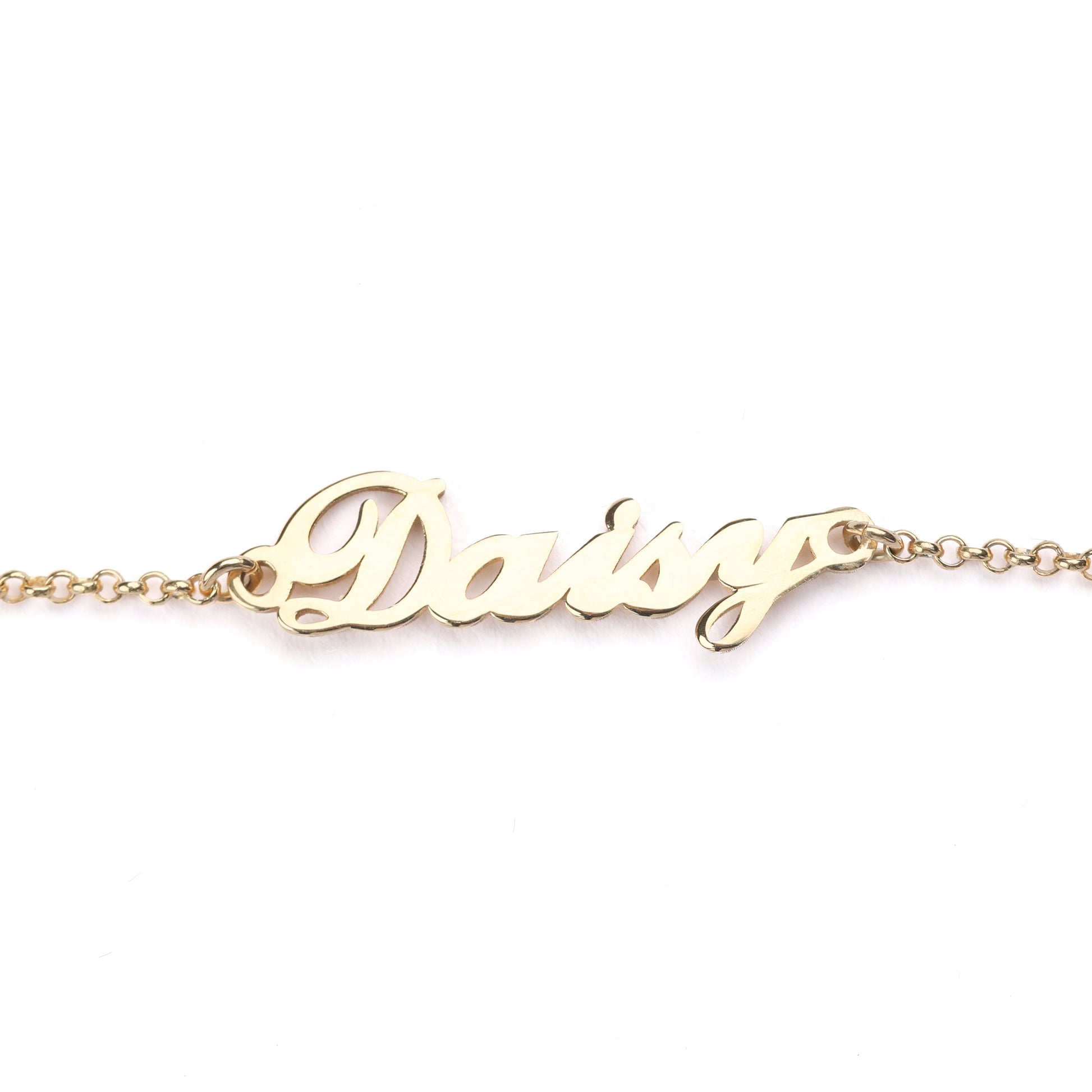 Women's solid gold necklace with personalised name 'Daisy' engraving on a white backgrounds