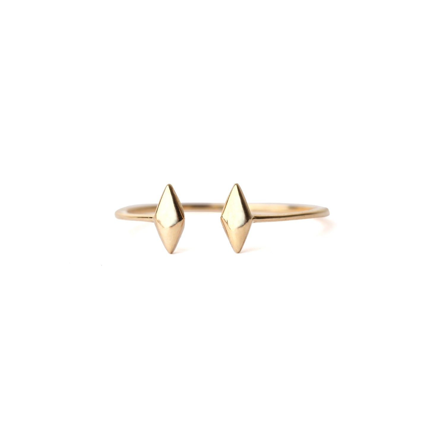 Women's solid yellow gold gap ring with diamond-shaped ends on a white background