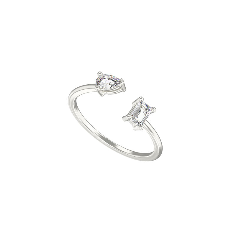 Women's rhodium plated sterling silver gap ring with pear and emerald cut cubic zirconia gemstones on a white background