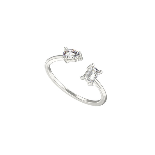 Women's rhodium plated sterling silver gap ring with pear and emerald cut cubic zirconia gemstones on a white background