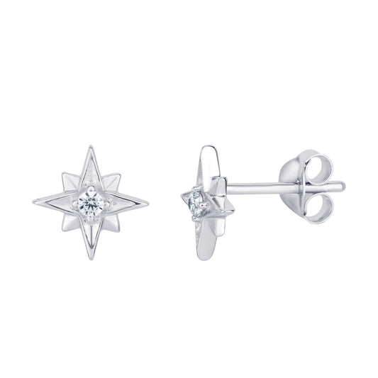 A pair of women's rhodium plated sterling silver star stud earrings with cubic zirconia gemstones in the centre on a white background