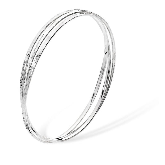 Women's Rhodium plated sterling silver hammered three bracelet bangle on a white background