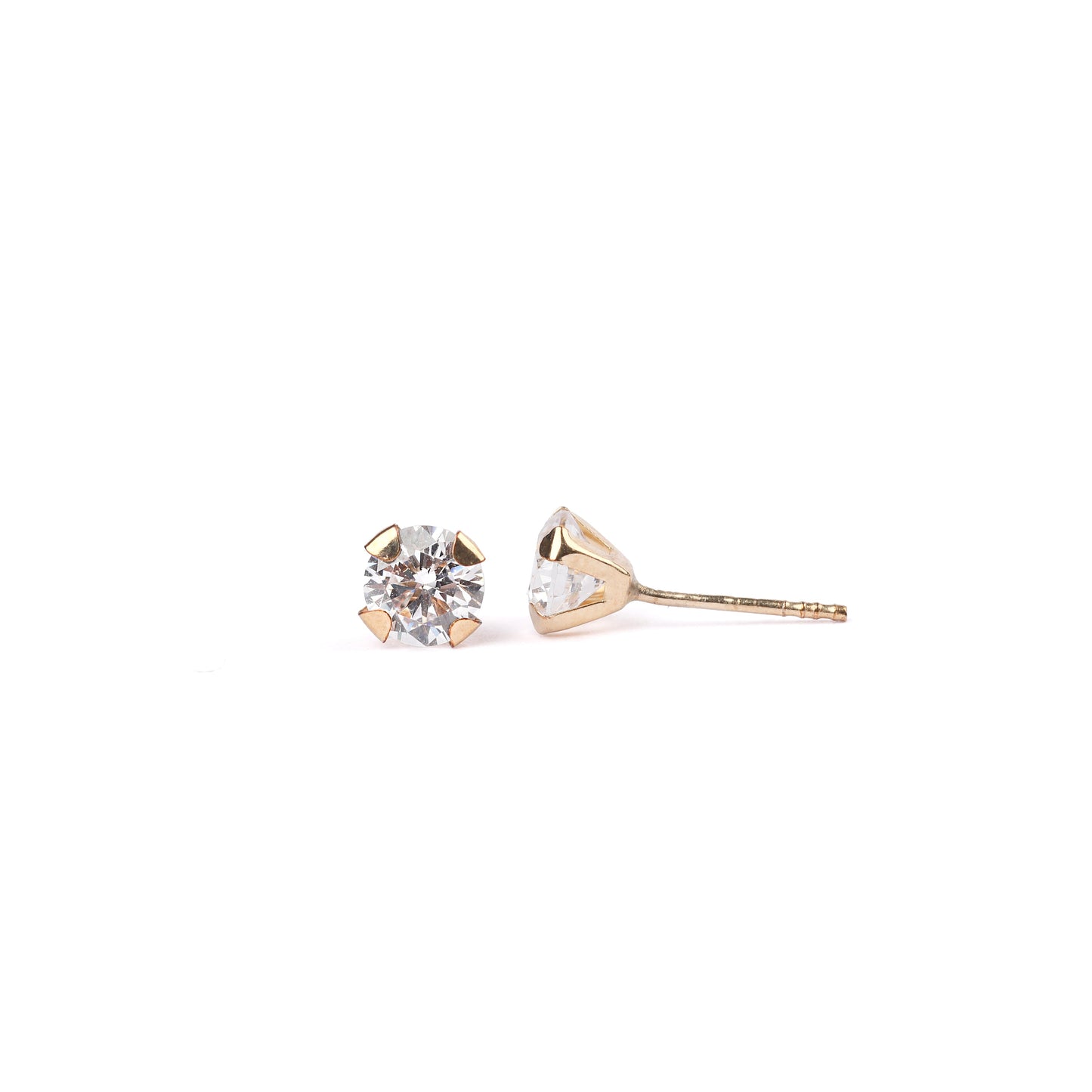 Women's solid yellow gold classic stud earrings with cubic zirconia gemstones on a white background