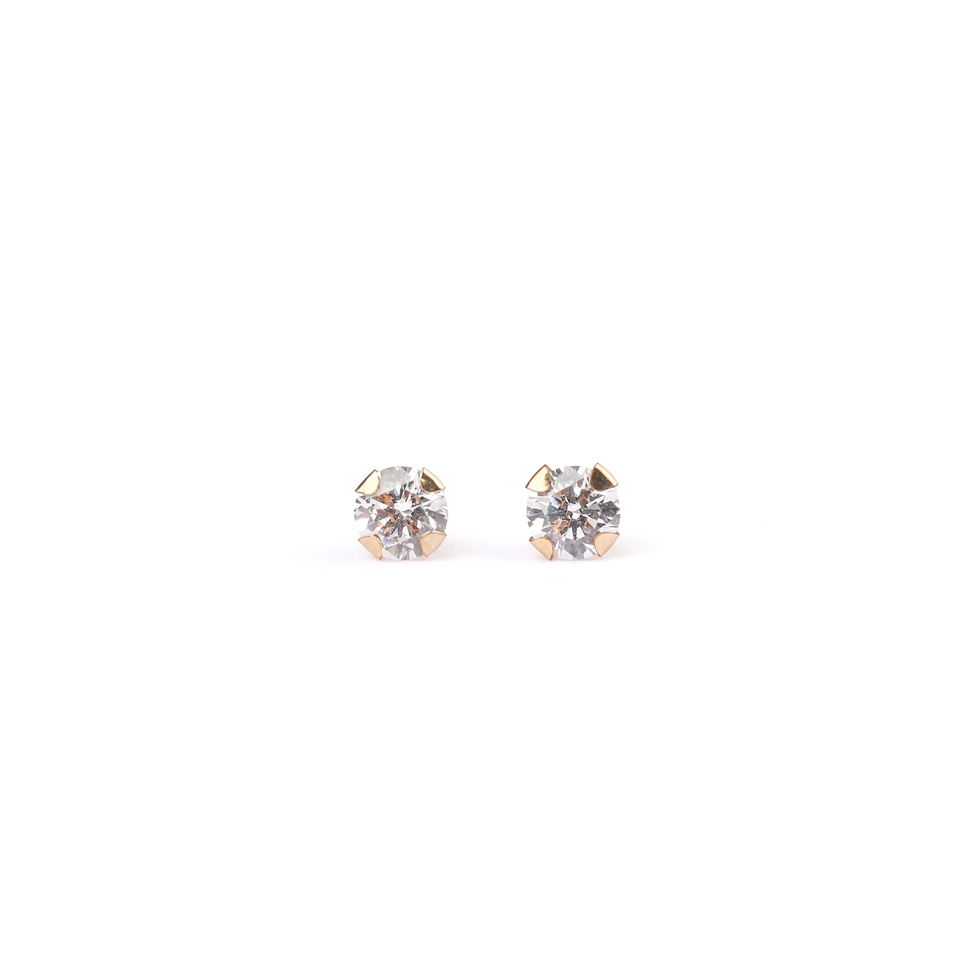 A pair of women's solid yellow gold classic cubic zirconia stud earrings on a white background
