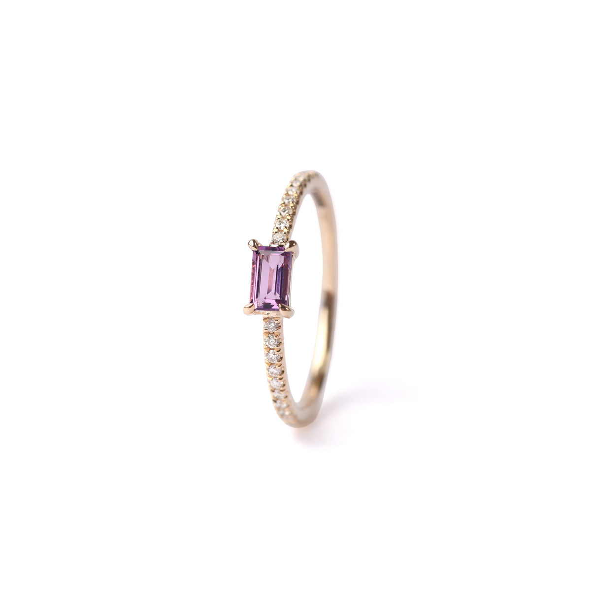 Women's solid yellow gold ring set with a central purple amethyst gemstone and small round diamonds on the shoulders each side of the amethyst, displayed on a white background standing up facing frontwards.