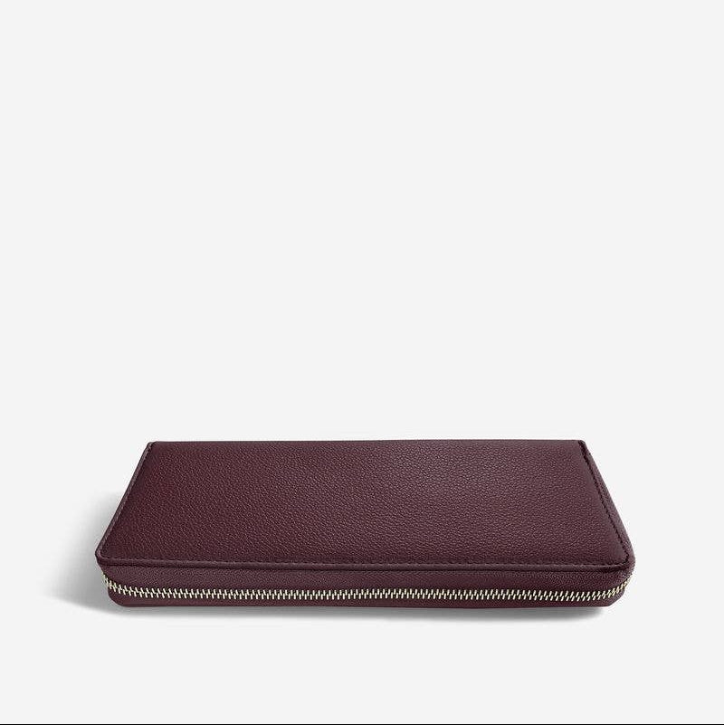 Burgundy Stackers jewellery roll on a white background