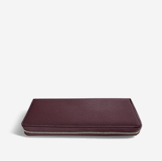 Burgundy Stackers jewellery roll on a white background