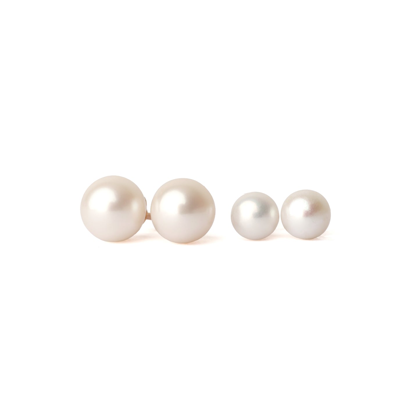 Two pairs of solid yellow gold and freshwater pearl earrings . The first set is classic size, the second set is small. Both pairs are facing forward and set on a white background for the shopper to view.