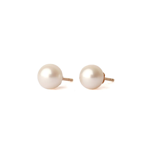 A pair of solid yellow gold and freshwater pearl earrings, classic size. Both face forward and are set on a white background for the shopper to view.