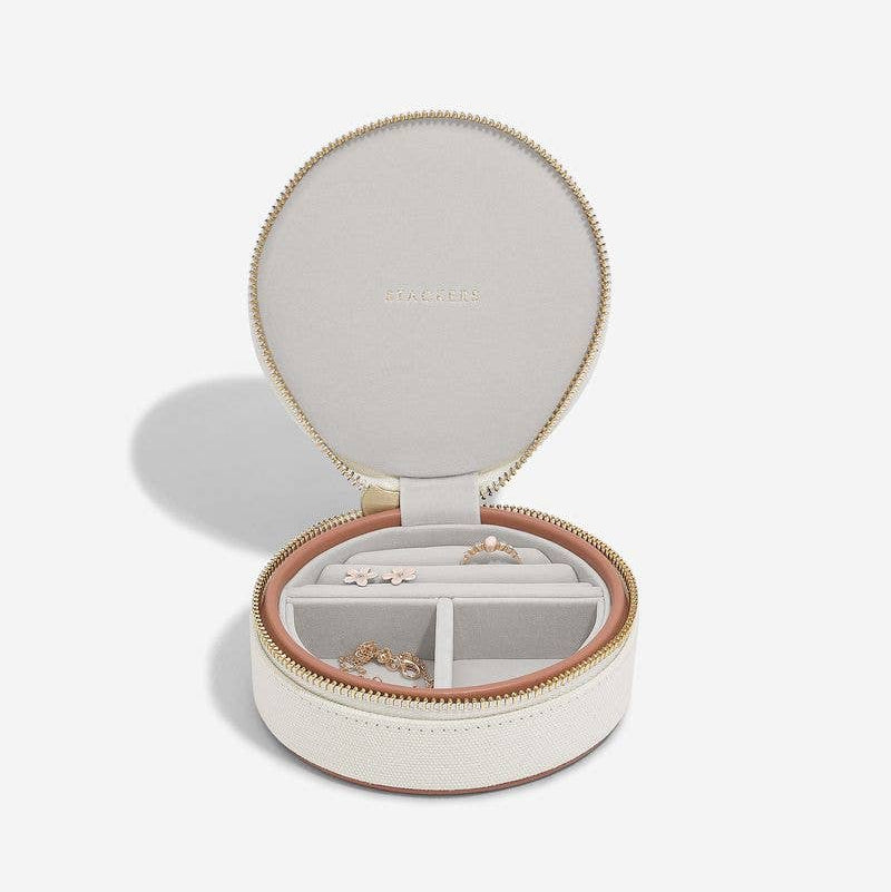 Blush and cream Stackers round travel jewellery box with open lid on a white background