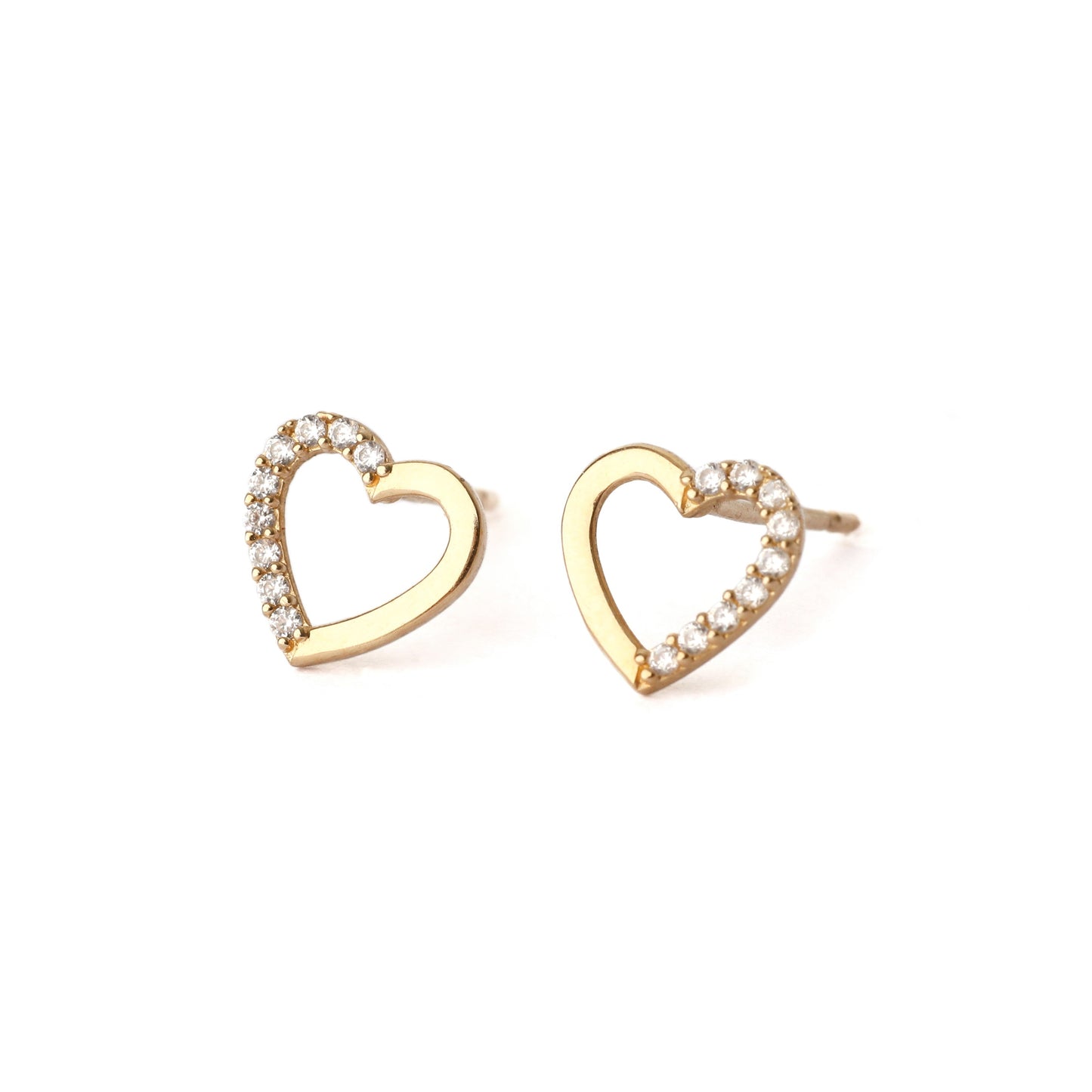 A pair of solid yellow gold heart shape earrings with an open centre. each earring has small cubic zirconia gemstones set into one side of the heart outline. The pair faces frontwards and both are displayed on a white background for the shopper to see.