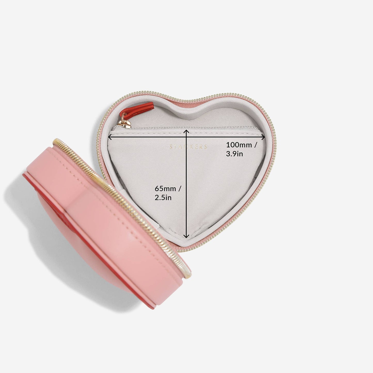 Heart-shaped pink and red Stackers travel jewellery case on a white background and internal dimensions