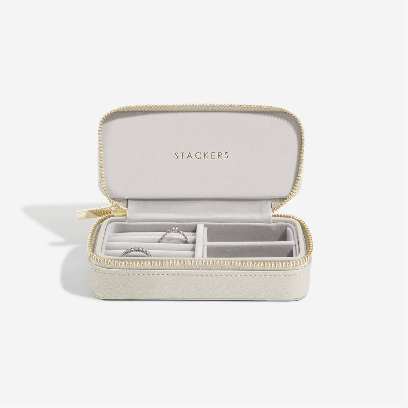Stackers jewelry box with a ring inside on a white background