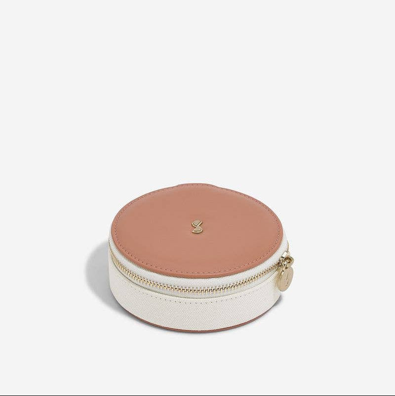 Stackers travel jewellery case, medium size, round in blush and cream, shown on a white background