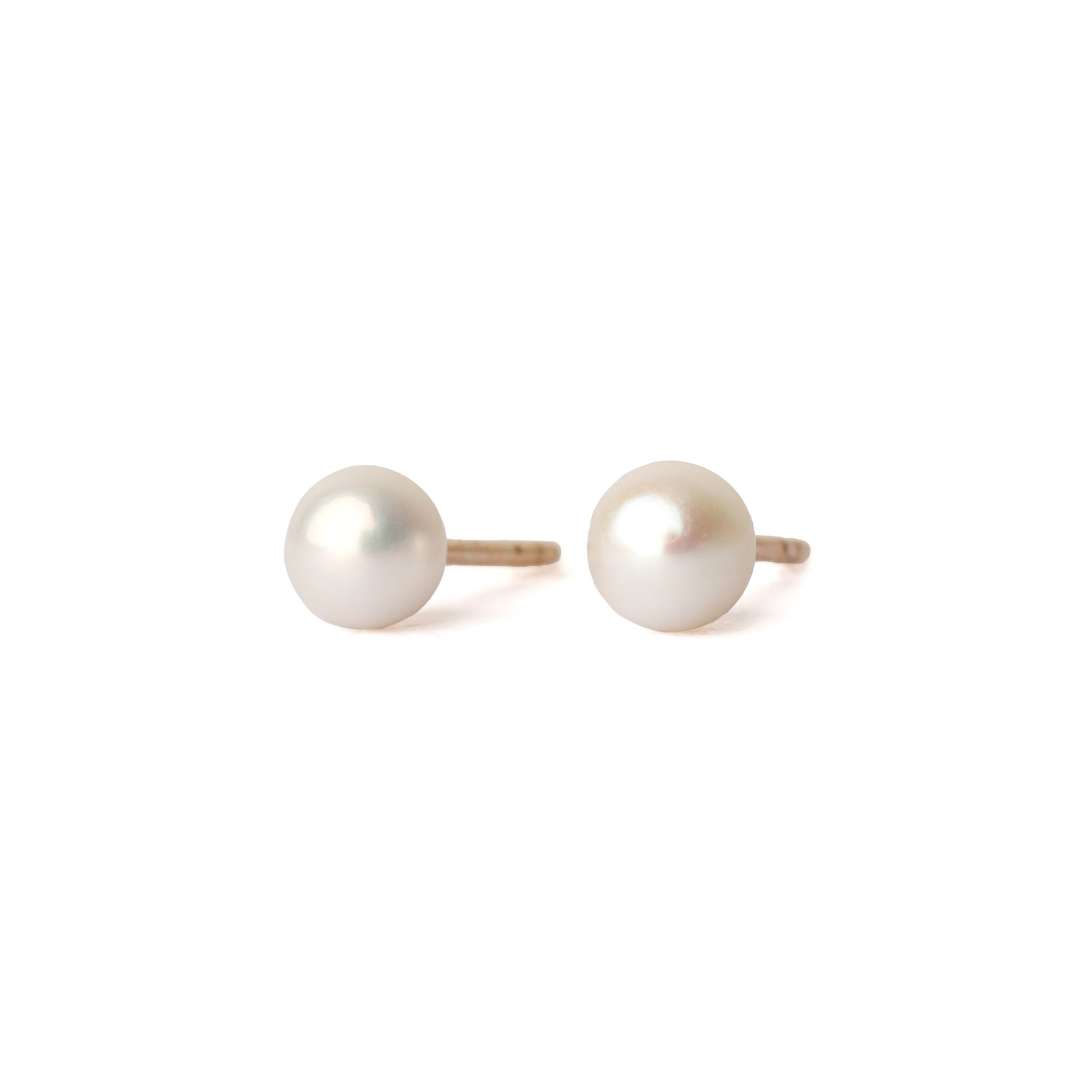 A pair of solid yellow gold and freshwater pearl earrings, small size. Both face forward and are set on a white background for the shopper to view.