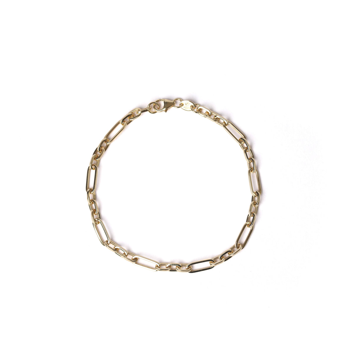 A women's solid gold paperclip chain bracelet with elongated oval links and a lobster clasp, displayed on a clean white background.