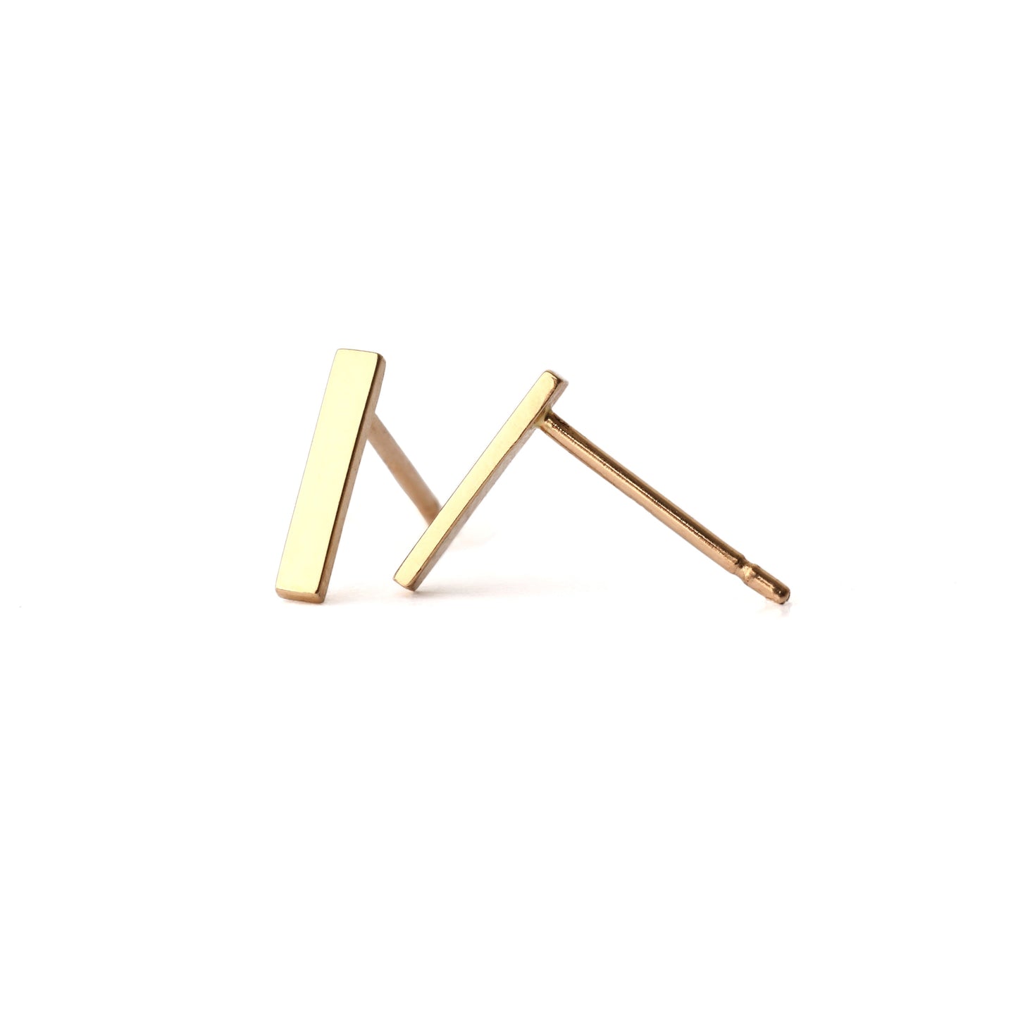 A pair of solid yellow gold bar stud earrings set on a white background for the shopper to view, one facing forwards one displayed side on.