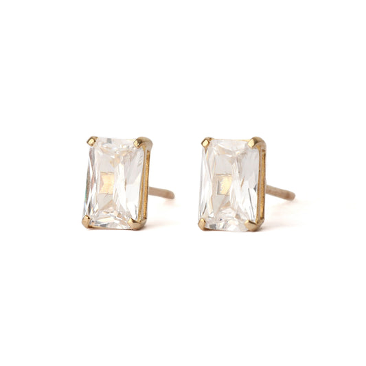 A pair of solid yellow gold and emerald cut cubic zirconia stud earrings. Both face face forward and are displayed on a white background.