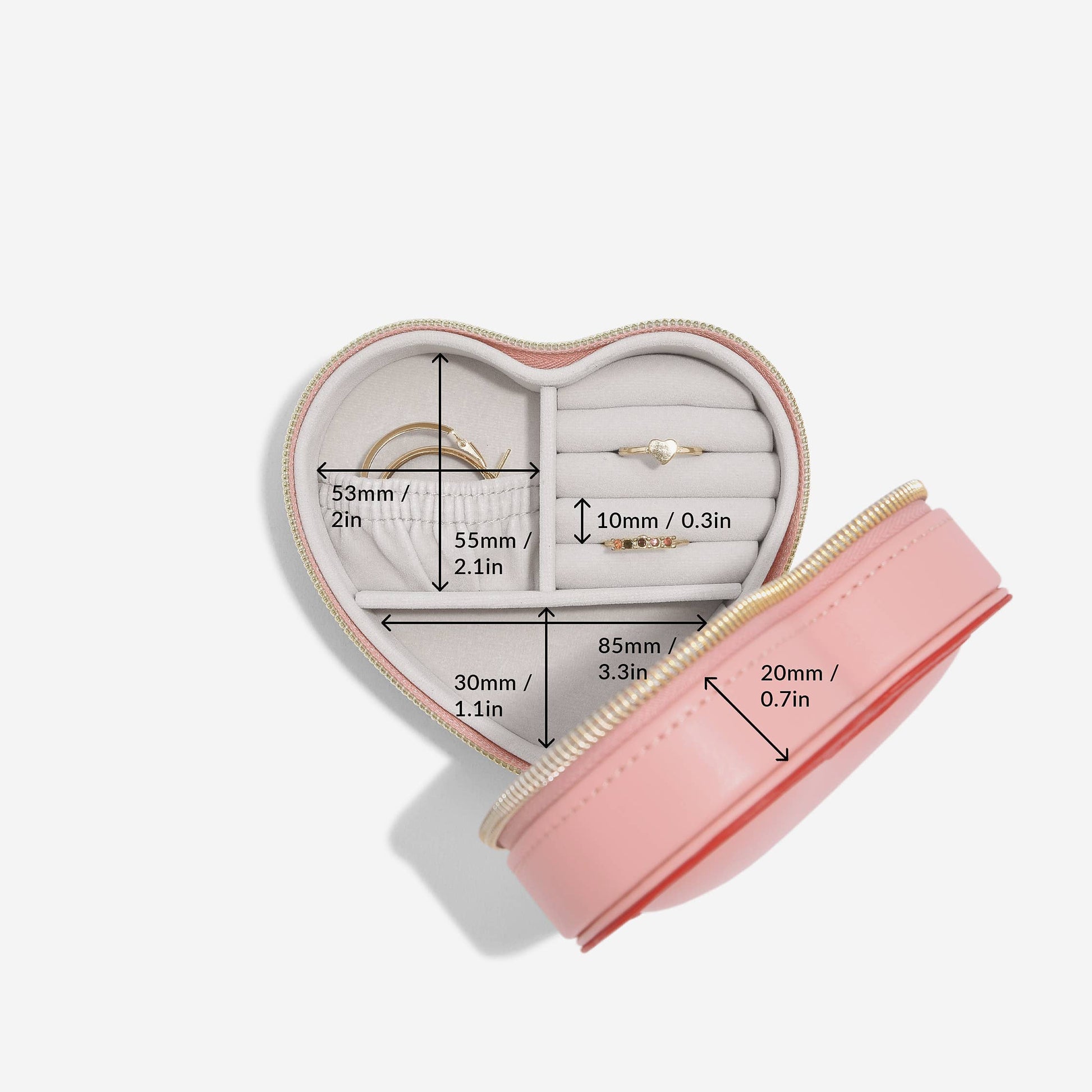 Heart-shaped pink and red Stackers travel jewellery case on a white background and internal dimensions