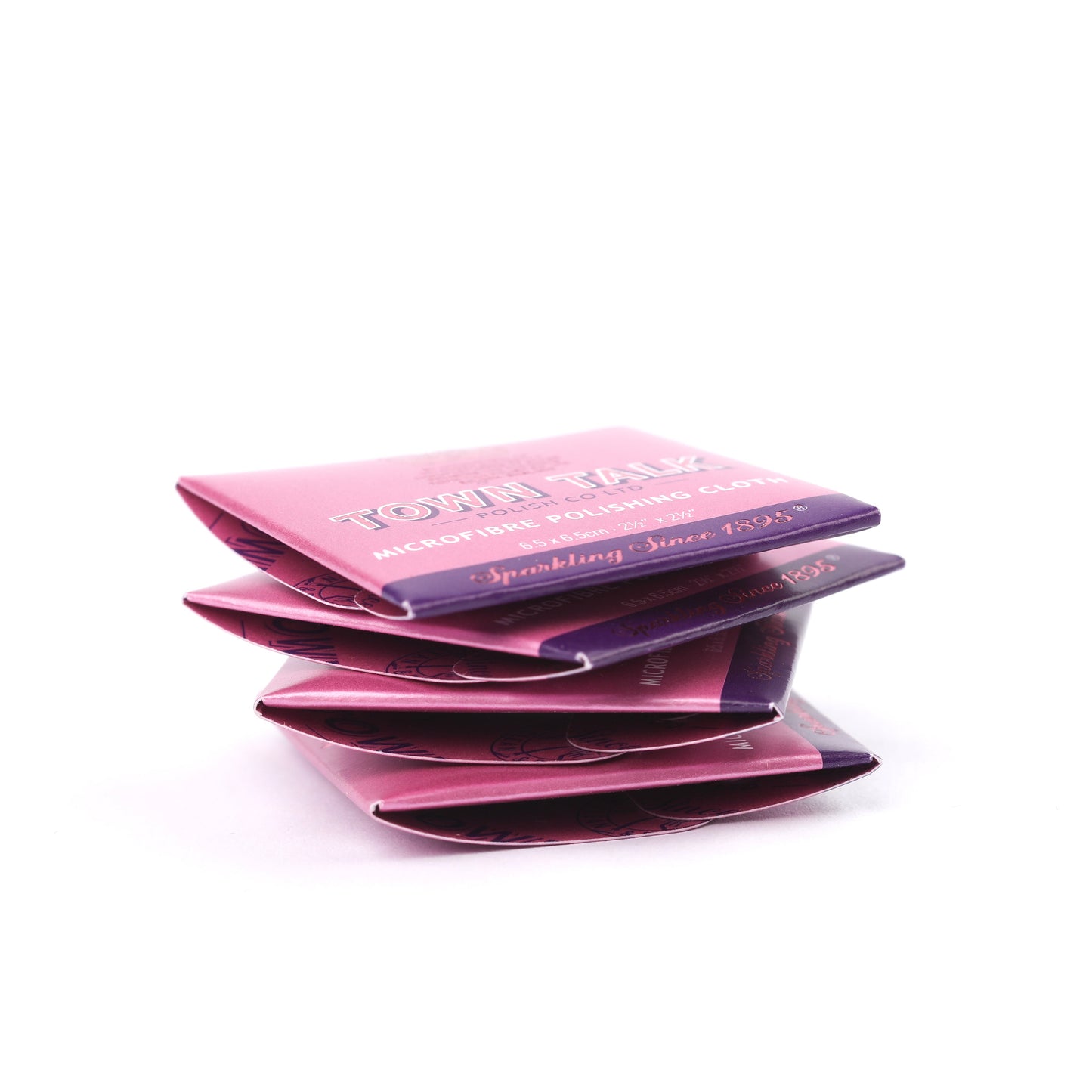 Four Town Talk universal microfibre polishing cloths for jewellery in pink boxes pilled on a white background