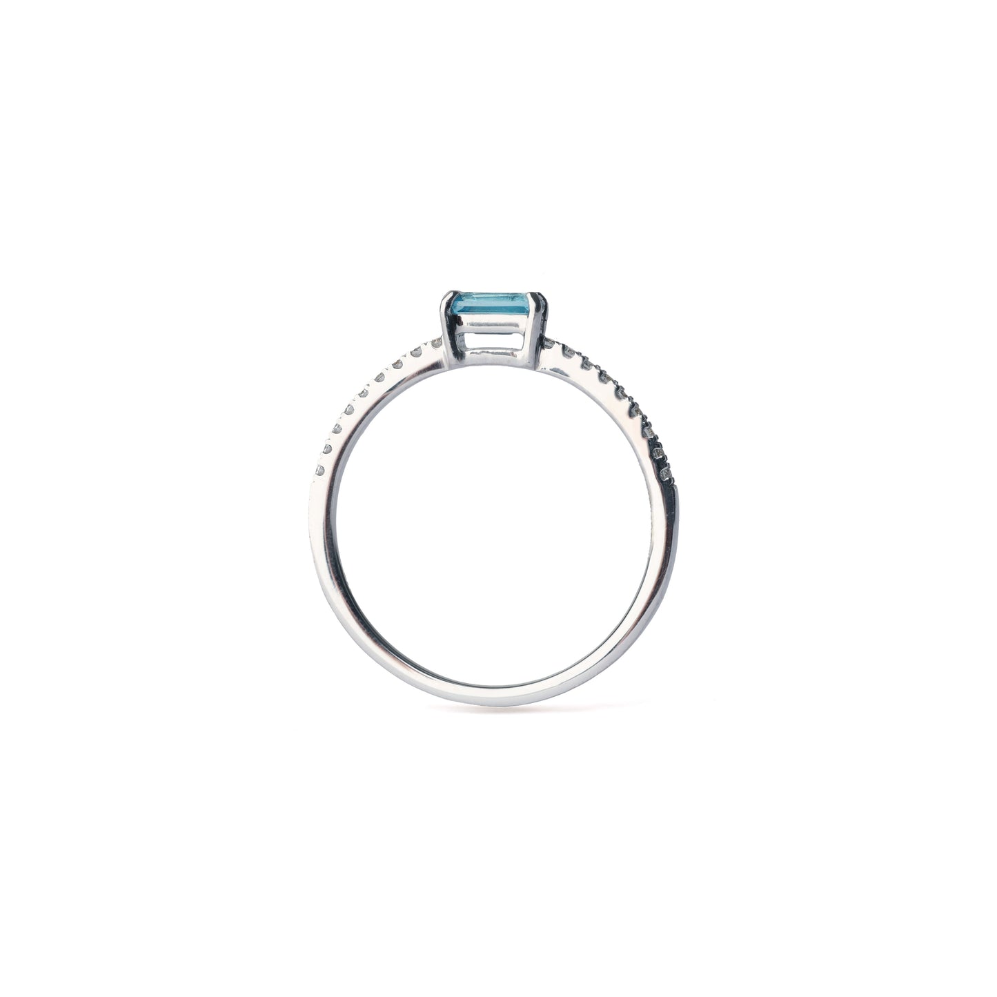 Women's white gold ring set with diamonds and blue topaz on a white background