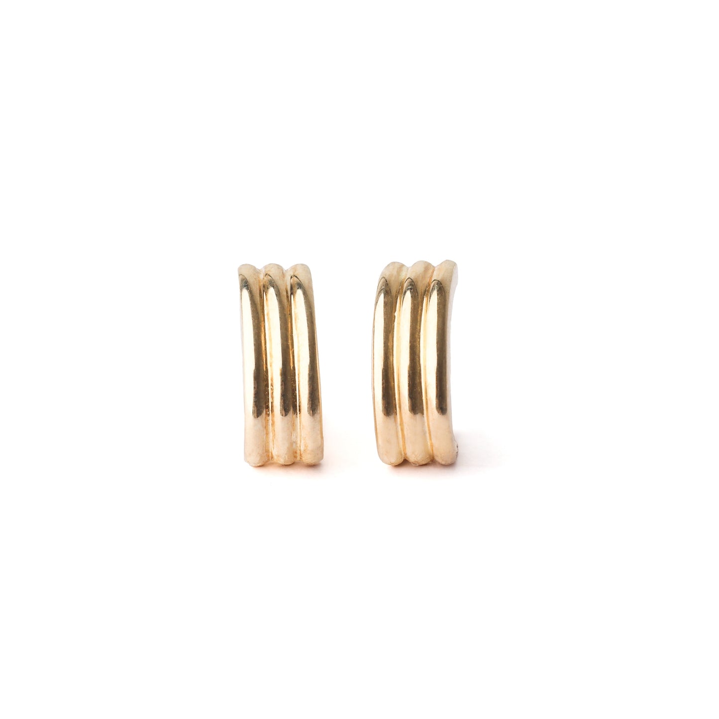 A pair of women's solid gold half hoop stud earrings on a white background