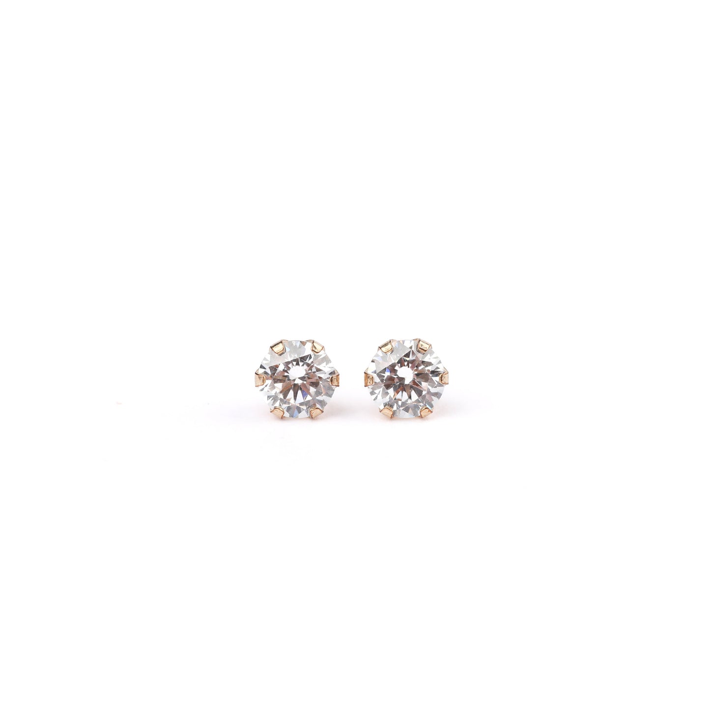 a pair of solid gold and cubic zirconia stud earrings on a white background