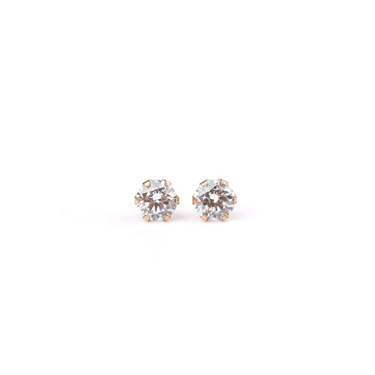 a pair of solid gold and cubic zirconia stud earrings on a white background
