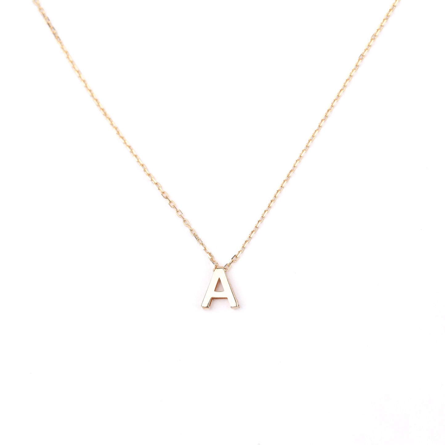women's solid gold necklace with a 'A' pendant on a white background