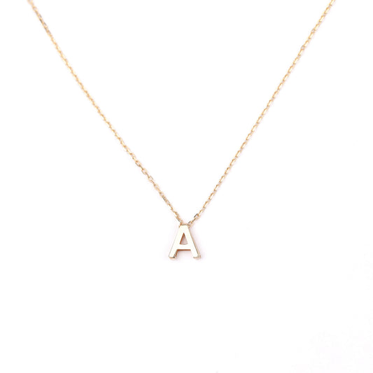 women's solid gold necklace with a 'A' pendant on a white background