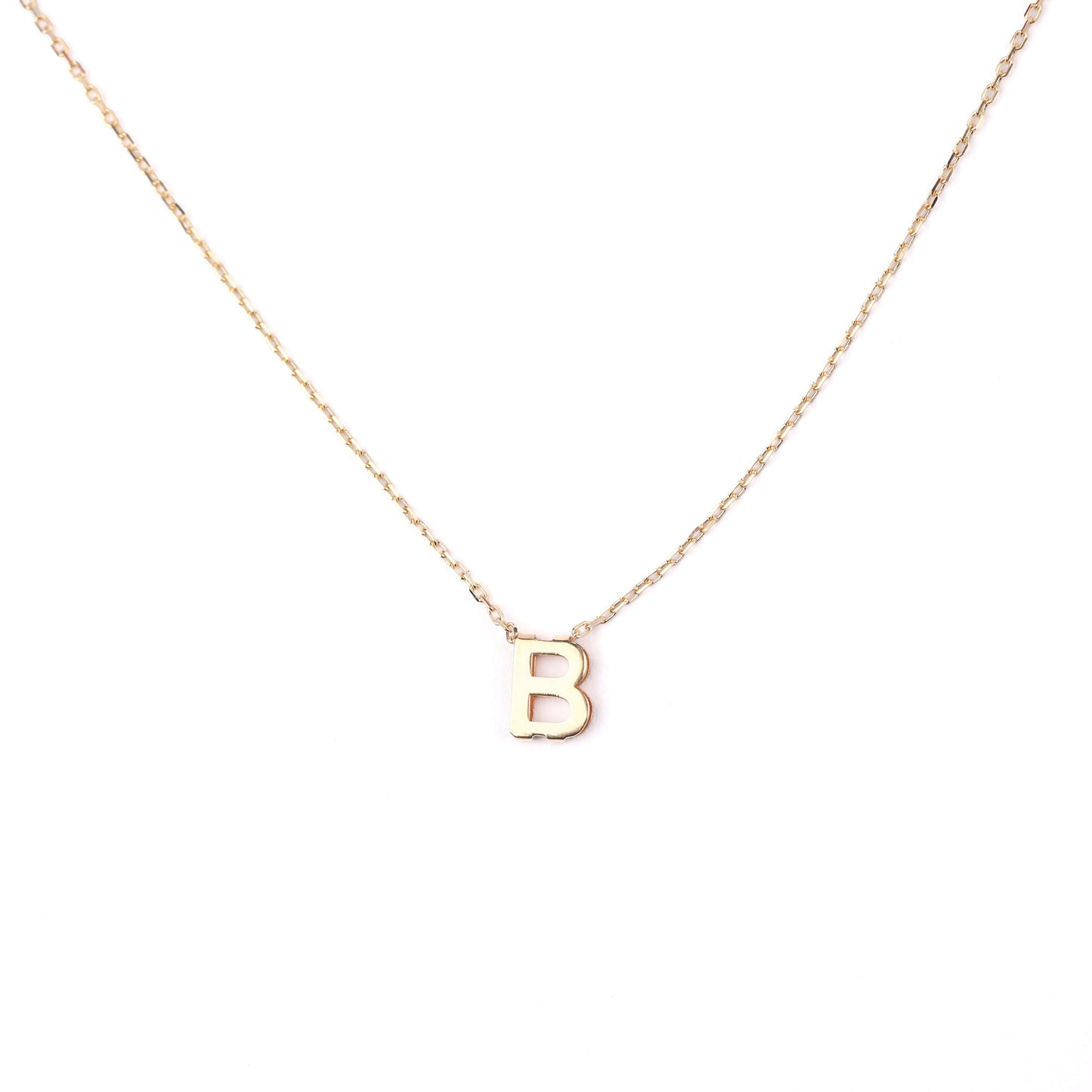 women's solid gold necklace with a 'B' pendant on a white background