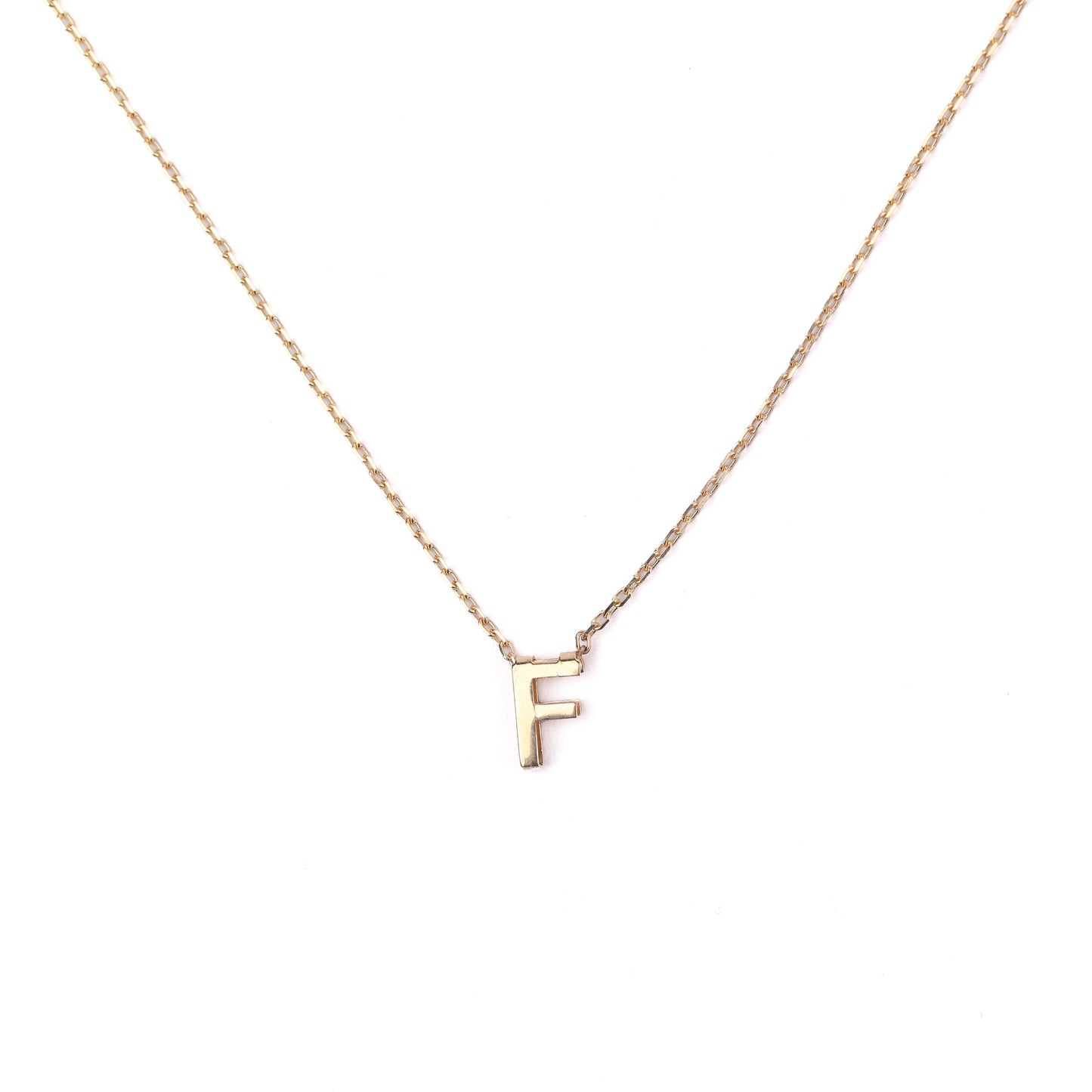 women's solid gold necklace with a 'F' pendant on a white background