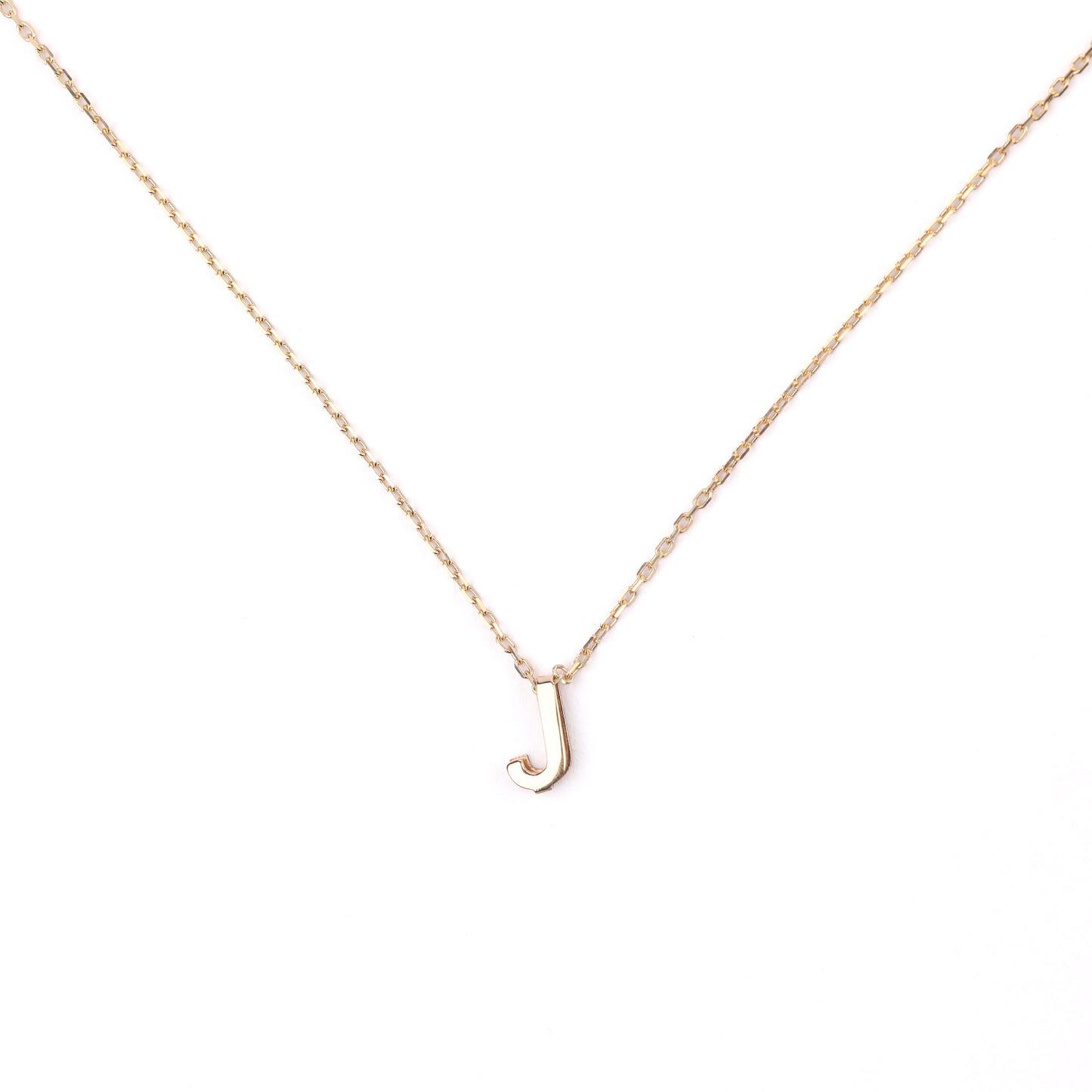 women's solid gold necklace with a 'J' pendant on a white background
