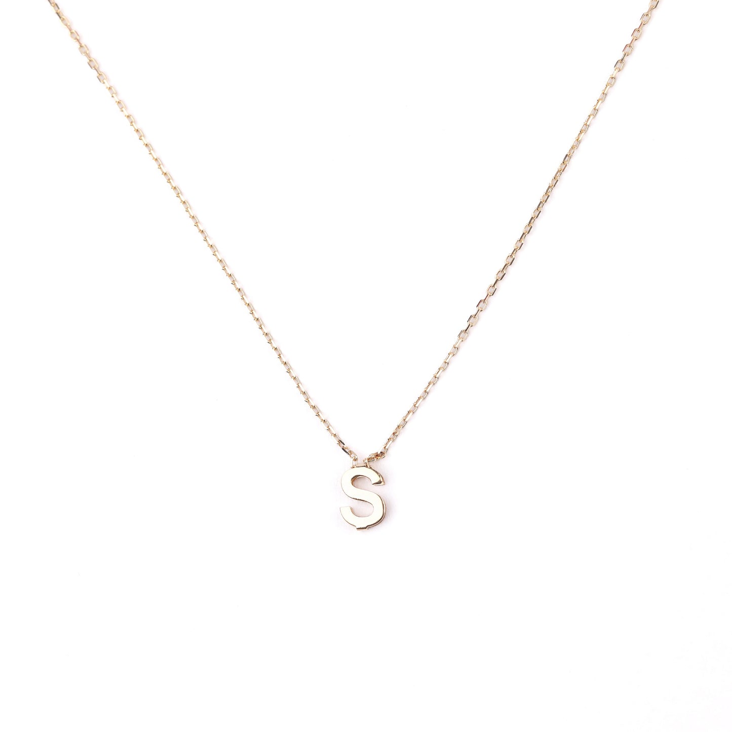 women's solid gold necklace with an S pendant on a white background