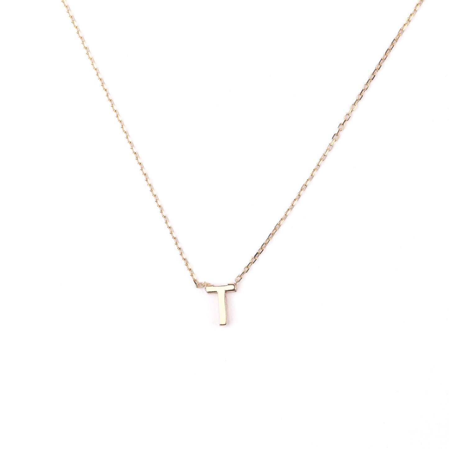 women's solid gold necklace with a 'T' pendant on a white background