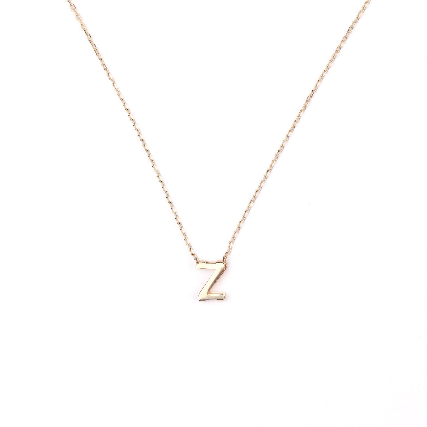women's solid gold necklace with initial 'Z' pendant on a white background