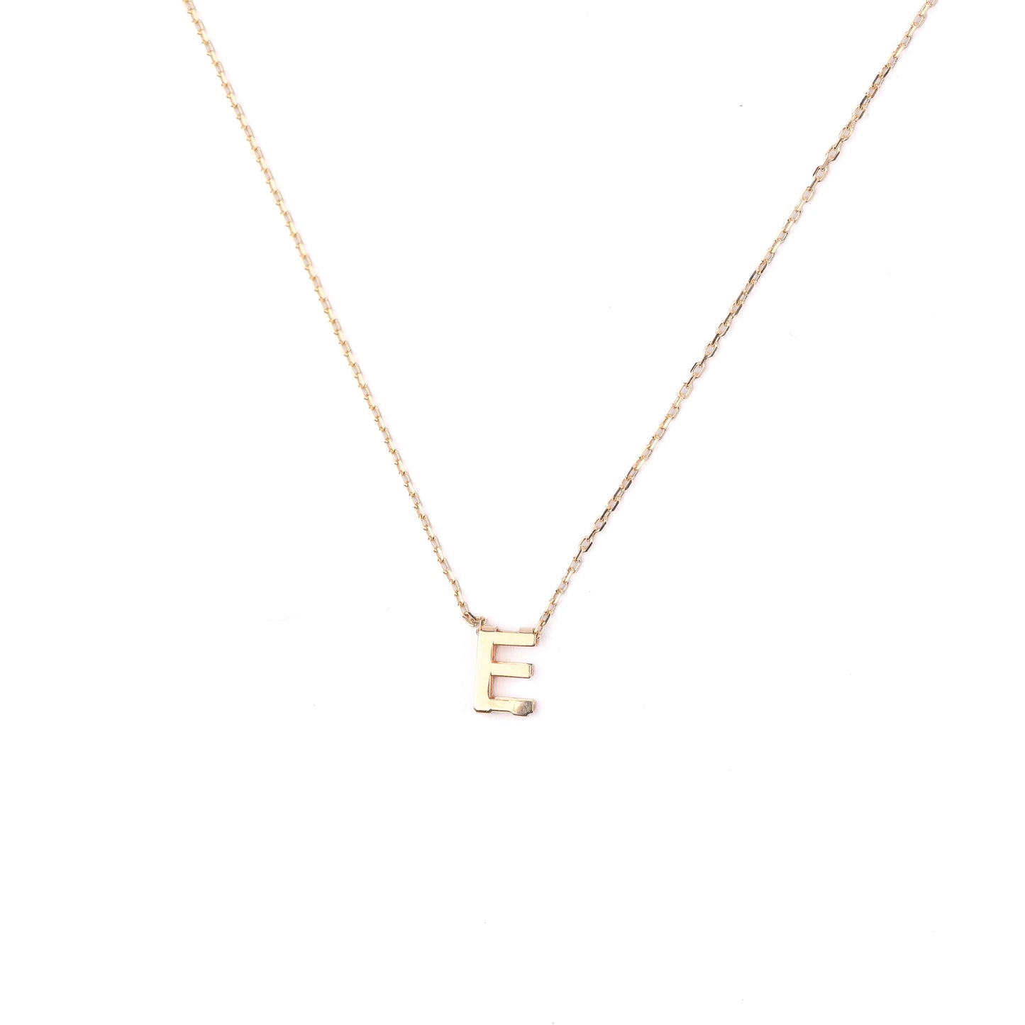 women's solid gold necklace with a small letter 'E' pendant on a white background initial necklace